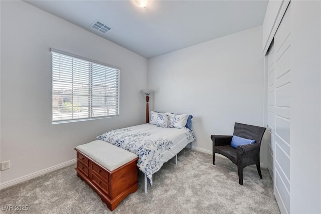 bedroom with light carpet, baseboards, and visible vents