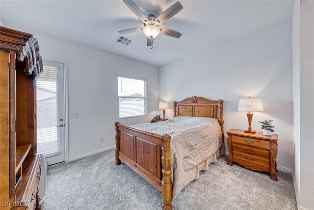 bedroom with access to exterior, light colored carpet, visible vents, ceiling fan, and baseboards