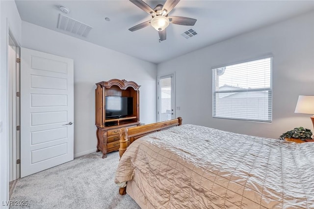 bedroom with light carpet, visible vents, and a ceiling fan