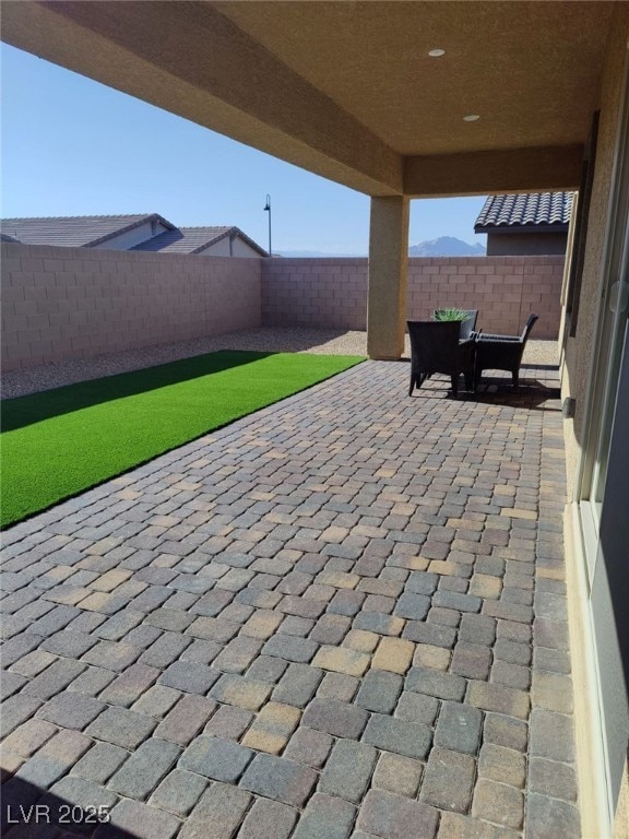 view of patio / terrace with outdoor dining space and a fenced backyard