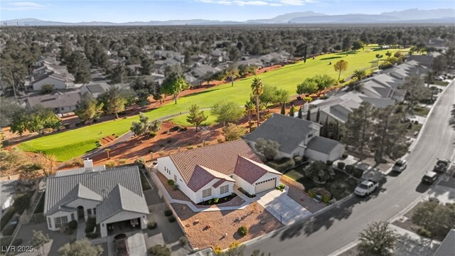 aerial view featuring a residential view, view of golf course, and a mountain view