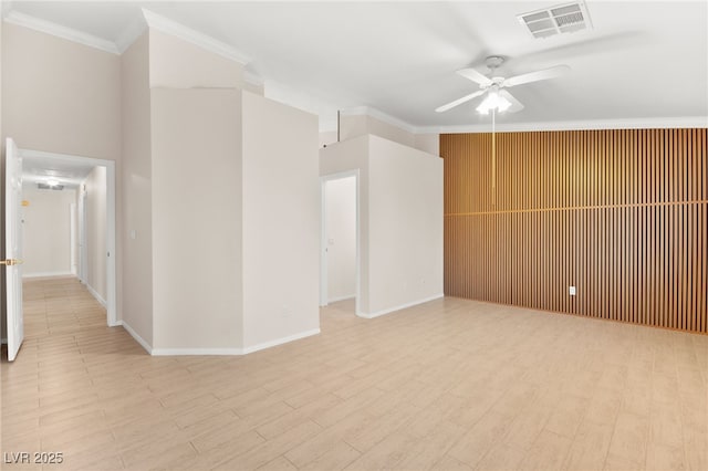 unfurnished room featuring a ceiling fan, light wood-type flooring, visible vents, and crown molding