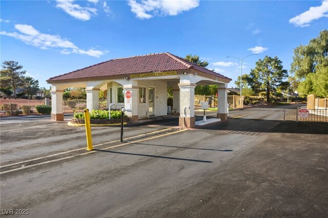 exterior space featuring fence and a gate