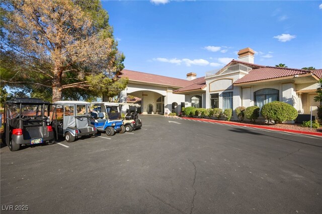 view of property featuring uncovered parking