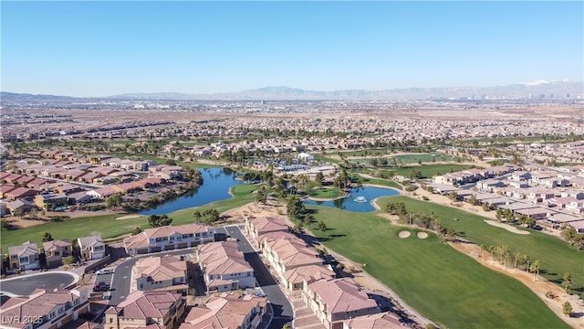 birds eye view of property featuring golf course view, a residential view, and a water and mountain view