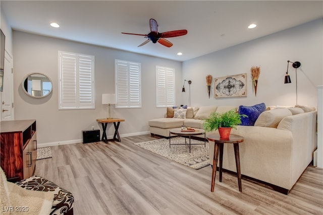 living area featuring light wood-style floors, recessed lighting, baseboards, and a ceiling fan