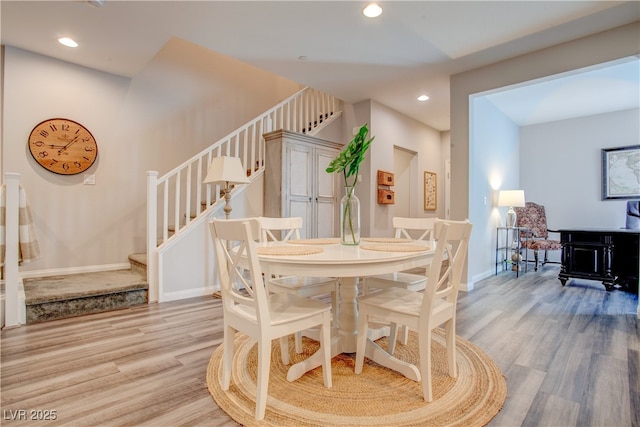 dining room with stairs, baseboards, wood finished floors, and recessed lighting