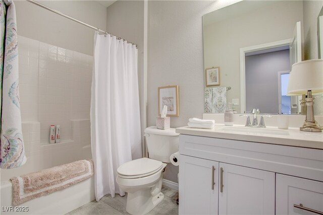 full bath with shower / tub combo, vanity, and toilet