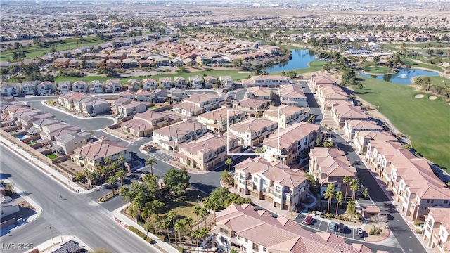 birds eye view of property with a water view and a residential view