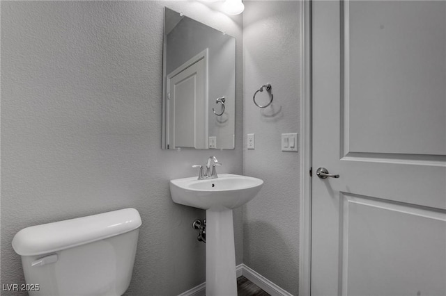 bathroom featuring toilet