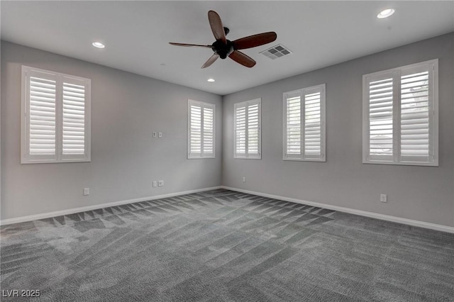 empty room featuring ceiling fan, recessed lighting, visible vents, and carpet