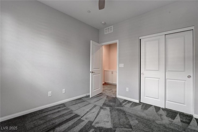 unfurnished bedroom with a ceiling fan, a closet, baseboards, visible vents, and carpet floors