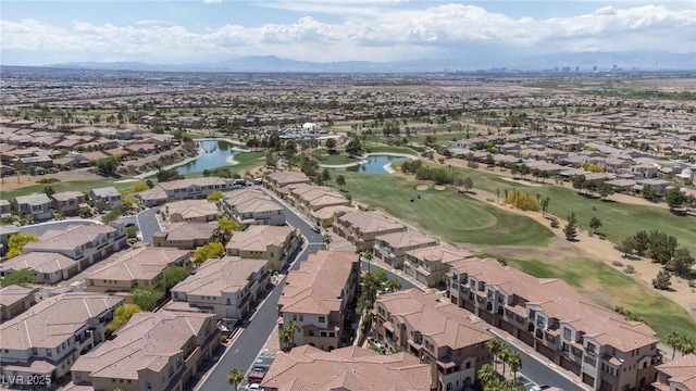bird's eye view with a water and mountain view, golf course view, and a residential view
