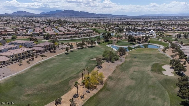 birds eye view of property with golf course view, a residential view, and a water and mountain view