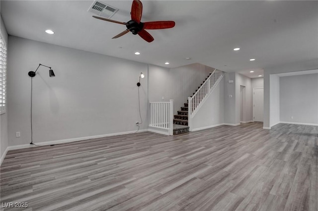 unfurnished living room with recessed lighting, visible vents, ceiling fan, wood finished floors, and stairway