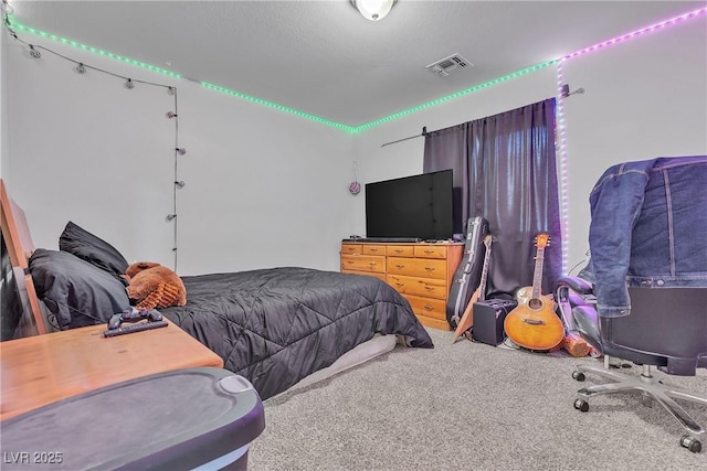 bedroom featuring carpet and visible vents