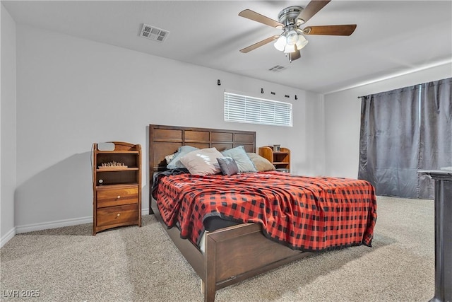 bedroom with carpet floors, baseboards, and visible vents