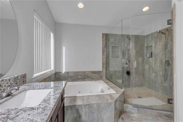 full bathroom featuring recessed lighting, a whirlpool tub, a shower stall, and vanity