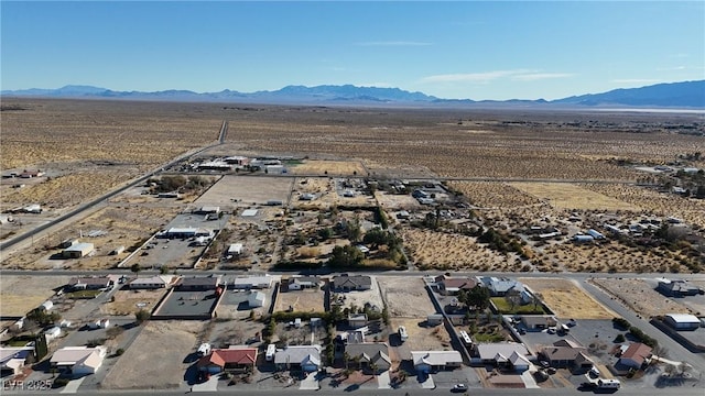 drone / aerial view featuring a residential view and a mountain view