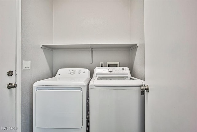 laundry area featuring washer and dryer and laundry area