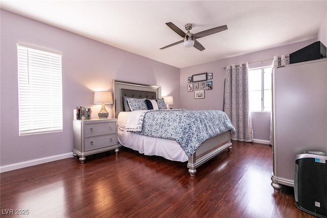 bedroom with ceiling fan, baseboards, and dark wood-style flooring