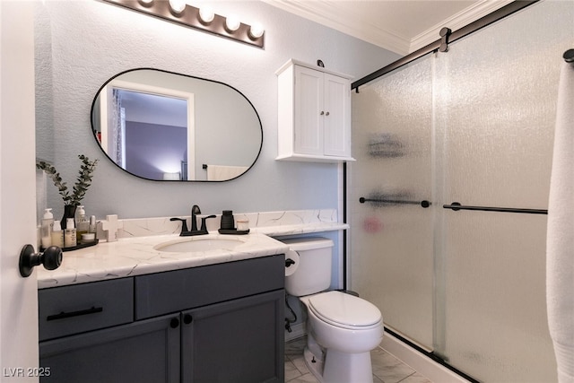 bathroom with marble finish floor, toilet, ornamental molding, vanity, and a shower stall