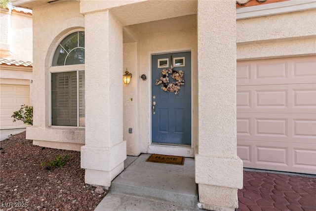 doorway to property with stucco siding