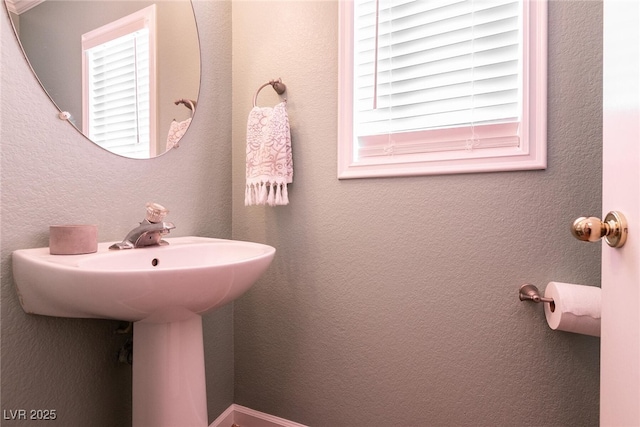 bathroom with a textured wall