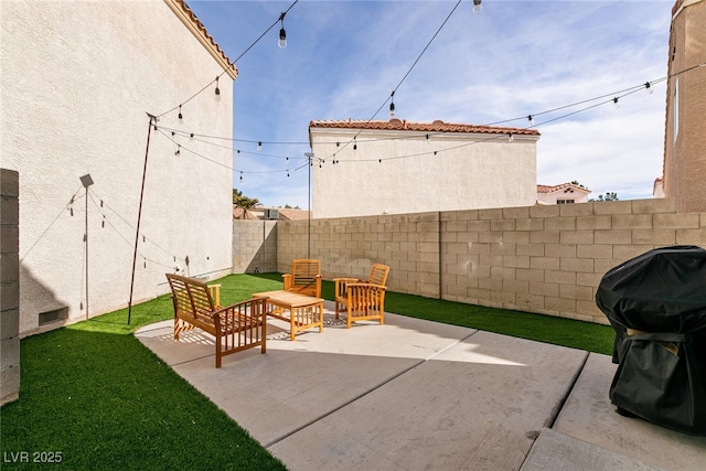 view of patio / terrace featuring area for grilling and a fenced backyard