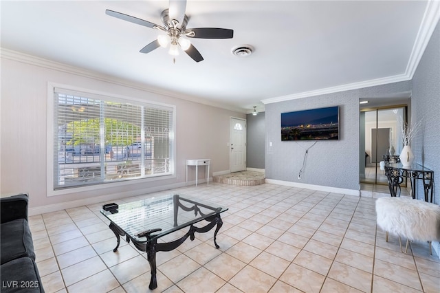 living area featuring light tile patterned floors, visible vents, baseboards, and crown molding