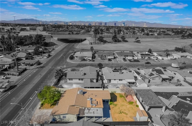 drone / aerial view featuring a mountain view and a residential view