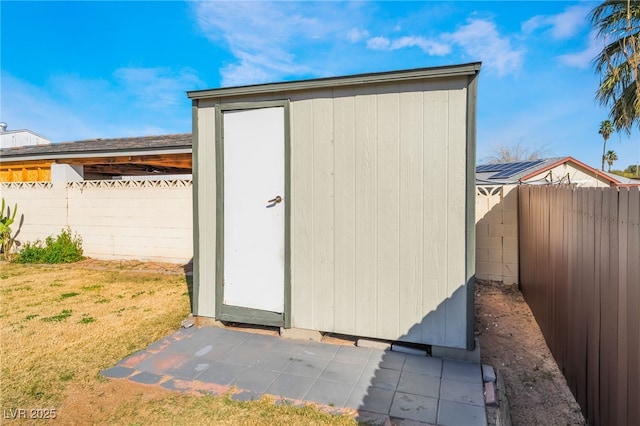 view of shed featuring a fenced backyard