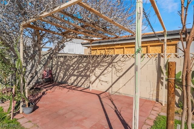 view of patio featuring fence