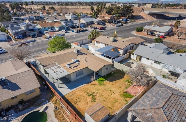 birds eye view of property with a residential view