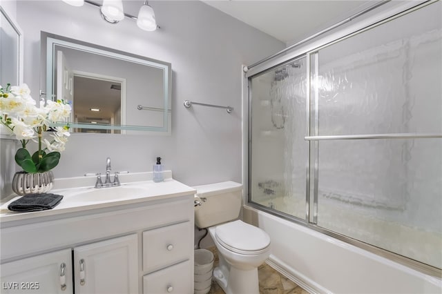 full bath with toilet, enclosed tub / shower combo, and vanity