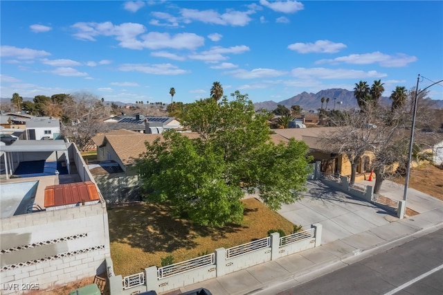 birds eye view of property with a mountain view