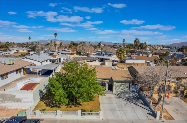 drone / aerial view with a residential view and a mountain view