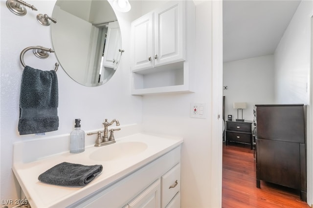 bathroom featuring vanity and wood finished floors