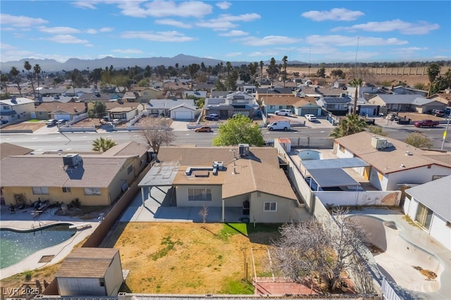 drone / aerial view featuring a mountain view and a residential view