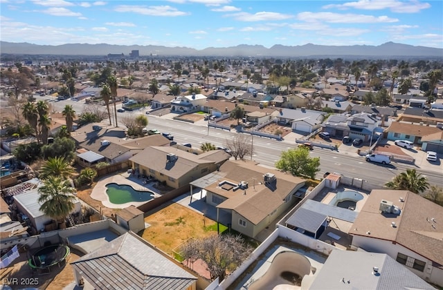 birds eye view of property with a residential view and a mountain view