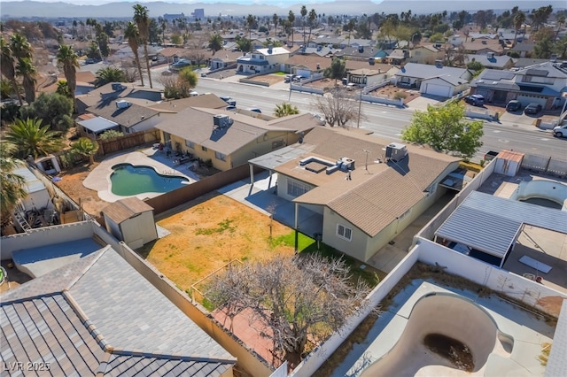 birds eye view of property with a residential view