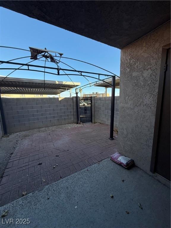 view of patio / terrace featuring fence