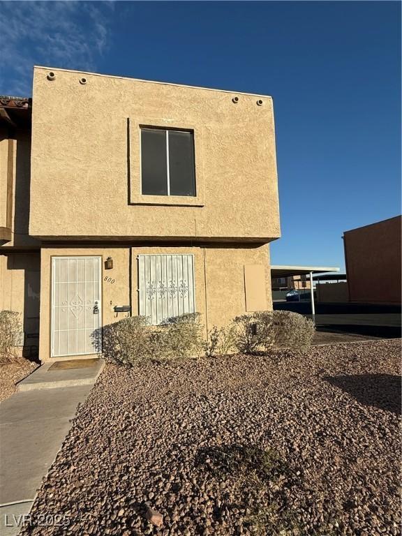 back of property with stucco siding