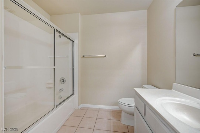 bathroom with toilet, combined bath / shower with glass door, vanity, baseboards, and tile patterned floors