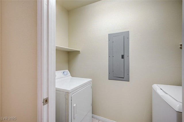 clothes washing area with laundry area, electric panel, and washing machine and clothes dryer