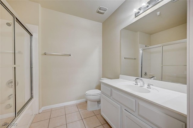 bathroom with enclosed tub / shower combo, tile patterned flooring, toilet, vanity, and baseboards