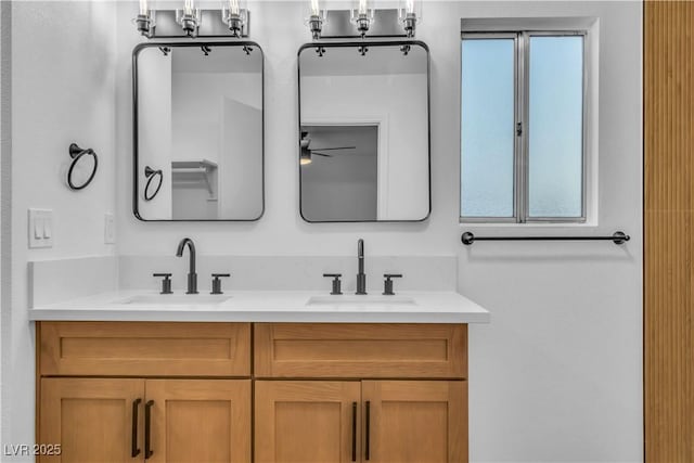 bathroom featuring double vanity and a sink