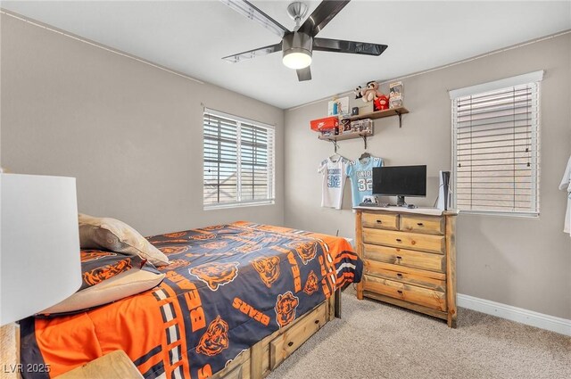 bedroom featuring a ceiling fan, baseboards, and carpet floors