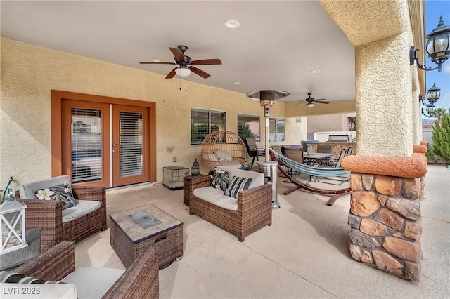 view of patio / terrace with outdoor dining area, a ceiling fan, and an outdoor hangout area