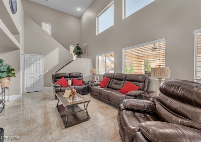living area with light tile patterned floors and baseboards